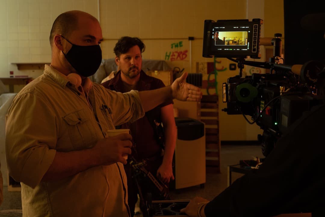 Behind the scenes photo 12 from Clone Cops production showing director danny dones and ted welch blocking a scene